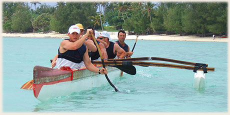 paddlers after race in typical polynesian outrigger canoe on Muri Lagoon